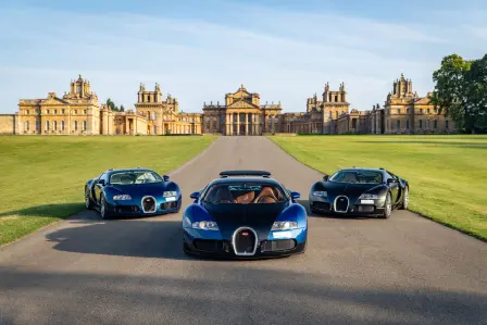 Three examples of the Bugatti Veyron, a model that revolutionized the automotive world, in formation at the stunning Blenheim Palace.