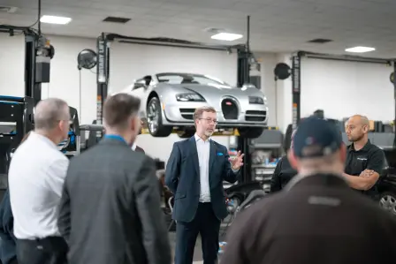 Trevor Hodgson-Phillips, Global After Sales Business Manager at Bugatti, congratulates the Bugatti Greenwich team.