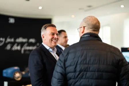 Hendrik Malinowksi, Managing Director at Bugatti, exchanging ideas at Château Saint-Jean during the welcoming in the Château Saint-Jean. Celebrating collaboration and commitment to continuous improvement in aftersales service.
