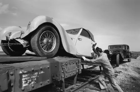 A Type 57S being loaded onto the train, with the Bugatti Royale following.