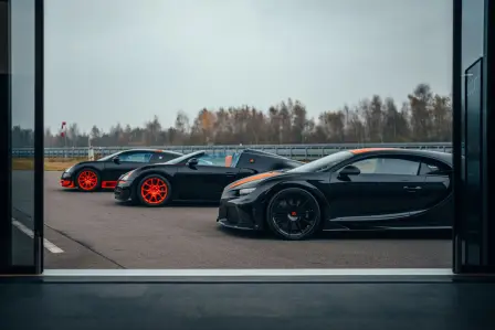 Bugatti's previous world record cars await the newest member of their illustrious circle.