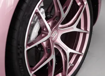 The wheels of the Bugatti Chiron Sport Alice" in "Silk Rosé".