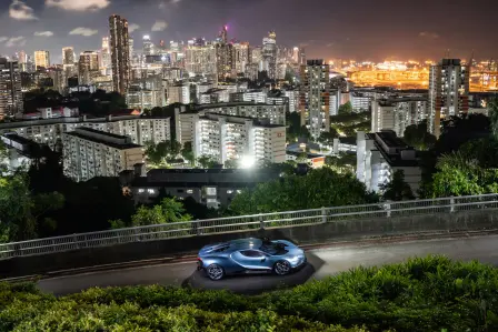 The Tourbillon stands amidst the modern architecture of Singapore and the greenery of Mont Faber.