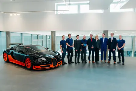 Bugatti Vienna – Most Improved Service Partner of 2024. A team driven by excellence, pictured with one of Bugatti's engineering masterpieces, the Bugatti Veyron 16.4 Super Sport World Record Edition.