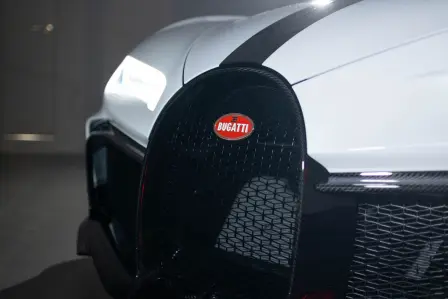 The first Bugatti Chiron Pur Sport finished in Quartz White and Grey Carbon is delivered to its new owner.