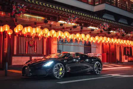 A sense of modernity and tradition is created as the Bugatti W16 Mistral finds a place in front of the Buddha Tooth Relic Temple.